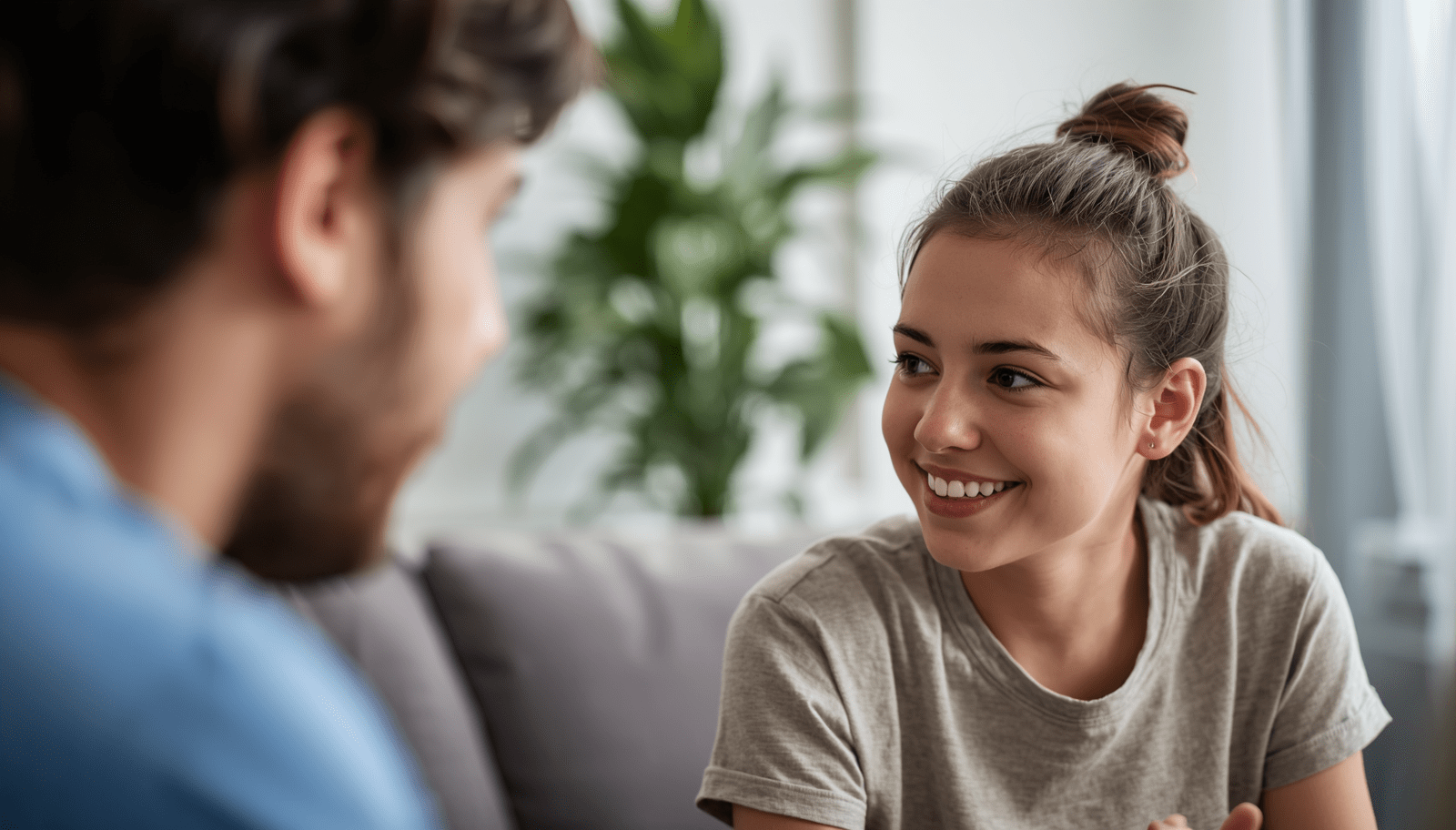 Compassionate parent supporting anxious teenager during online counselling session